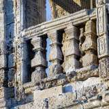 Il campanile, la cui pietra in tufo � stata erosa da secoli di vento proveniente dal mare...